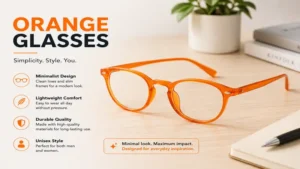 Minimalist orange glasses with slim frames arranged on a modern wooden desk